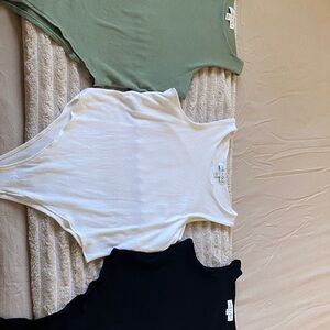 She & Sky bodysuits. Green, white and black. Size L